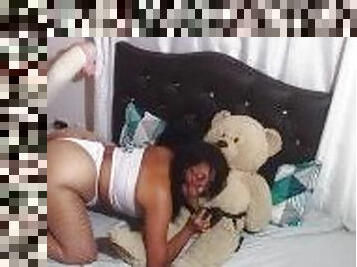 brunette pleasures teddy bear with her dildo