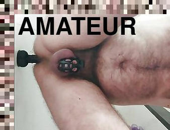 More dildo riding in chastity for this horny bear