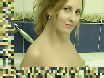 Brunette teen washes her cute tits