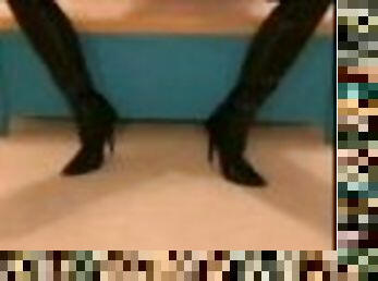 Kitty stroking and teasing herself in nylons and long boots