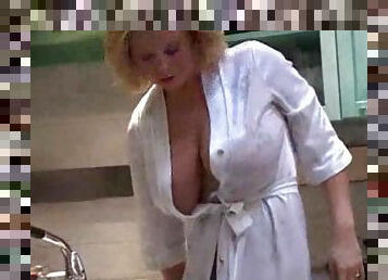 Mother in her kitchen teasing big tits