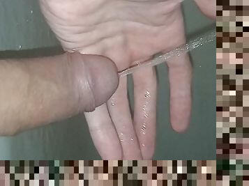 A young guy after a long abstinence wanted to pee and after solitude did pissing right on his hand and in the bath enjoy