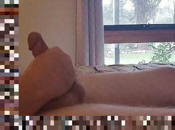 Fat hubby jerking off in front of an open window