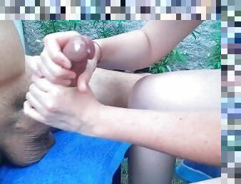 A handjob with two hands in the nature of Brazil