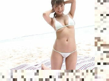Big Japanese tits are stunning in a bikini on the beach