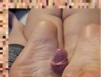 Jerking him off with my smooth soles