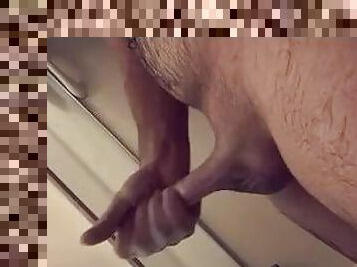 Guy plays with hard cock in shower