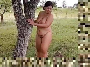 Devska walks completely naked in the countryside as cars pass