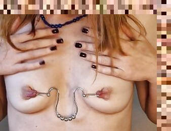 Stretching of pierced nipples with paper clips