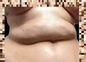 Chubby Goth Girl Rubs Oil On Big Tummy & Tits