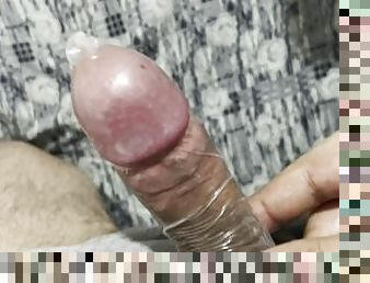 Masturbation with condom over black Dick
