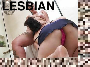 Curvy lesbians with big tits fuck in the bathroom