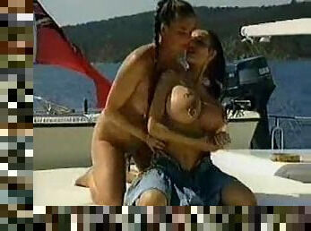 Pierced milf pussy is fisted on the boat