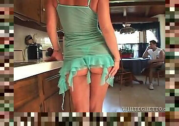 Housewife in kitchen teases in sheer lingerie
