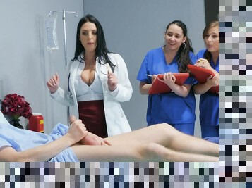 Premium female shows younger nurses how to deal with patients